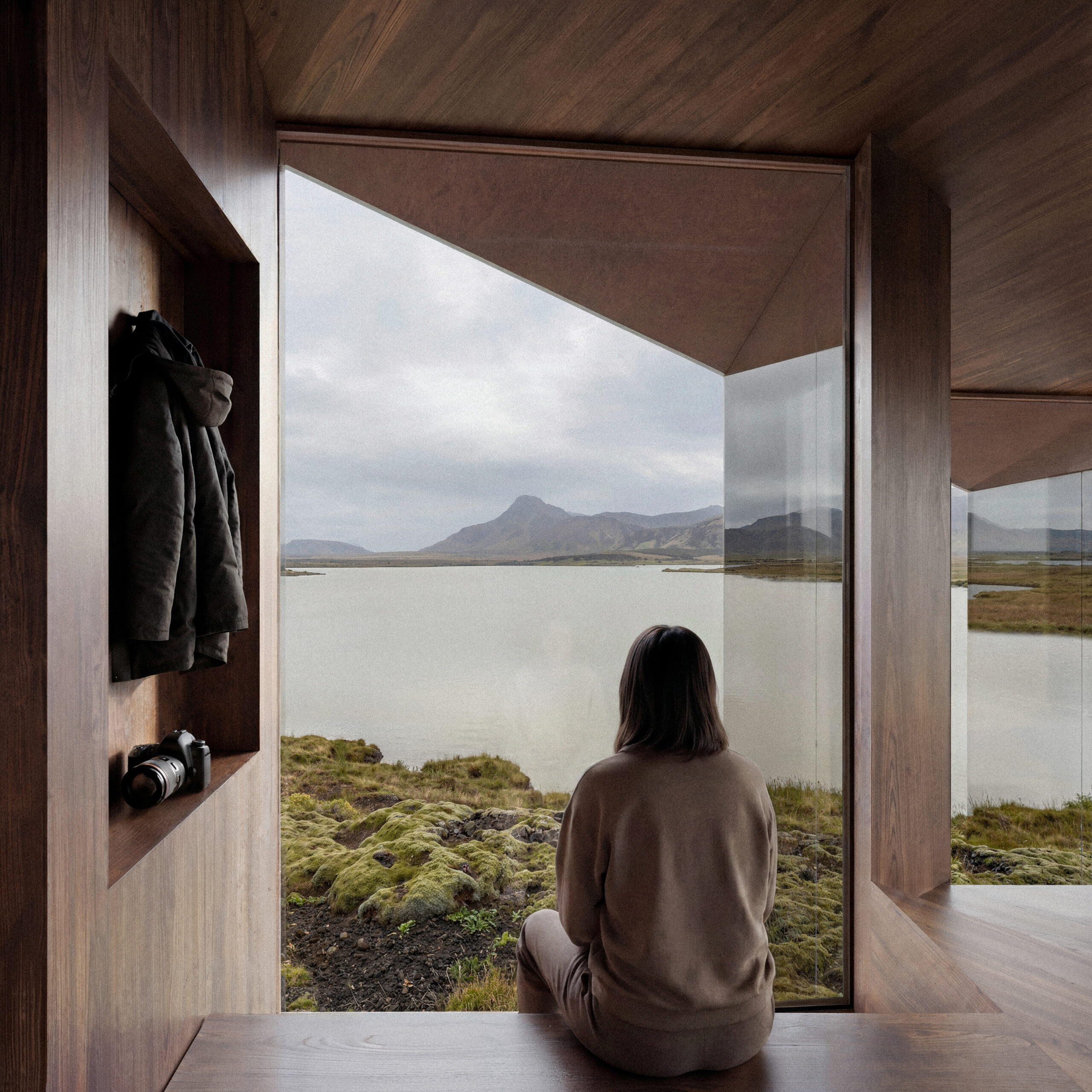 Perspective 3D concours architecture intérieure par Pierzo, cadrant une vue minimaliste sur un lac et une montagne islandaise depuis une alcôve en bois.